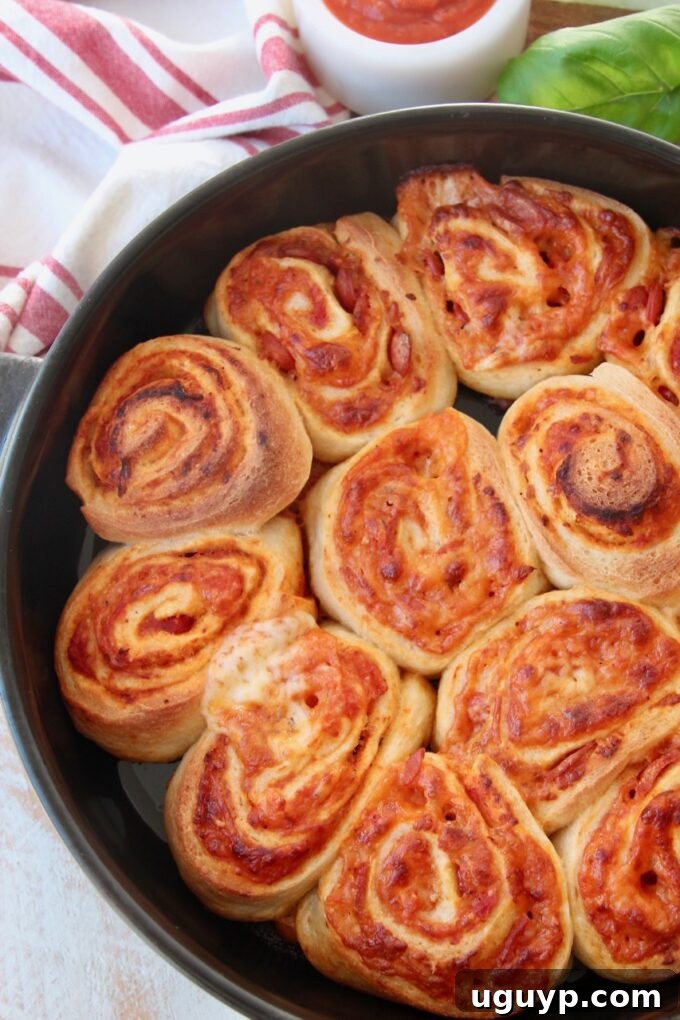 pizza rolls in black baking dish