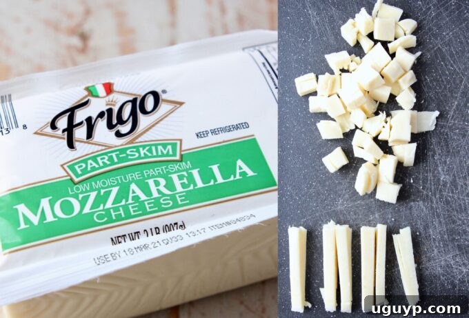 mozzarella cheese in package and cut into cubes on cutting board for pizza