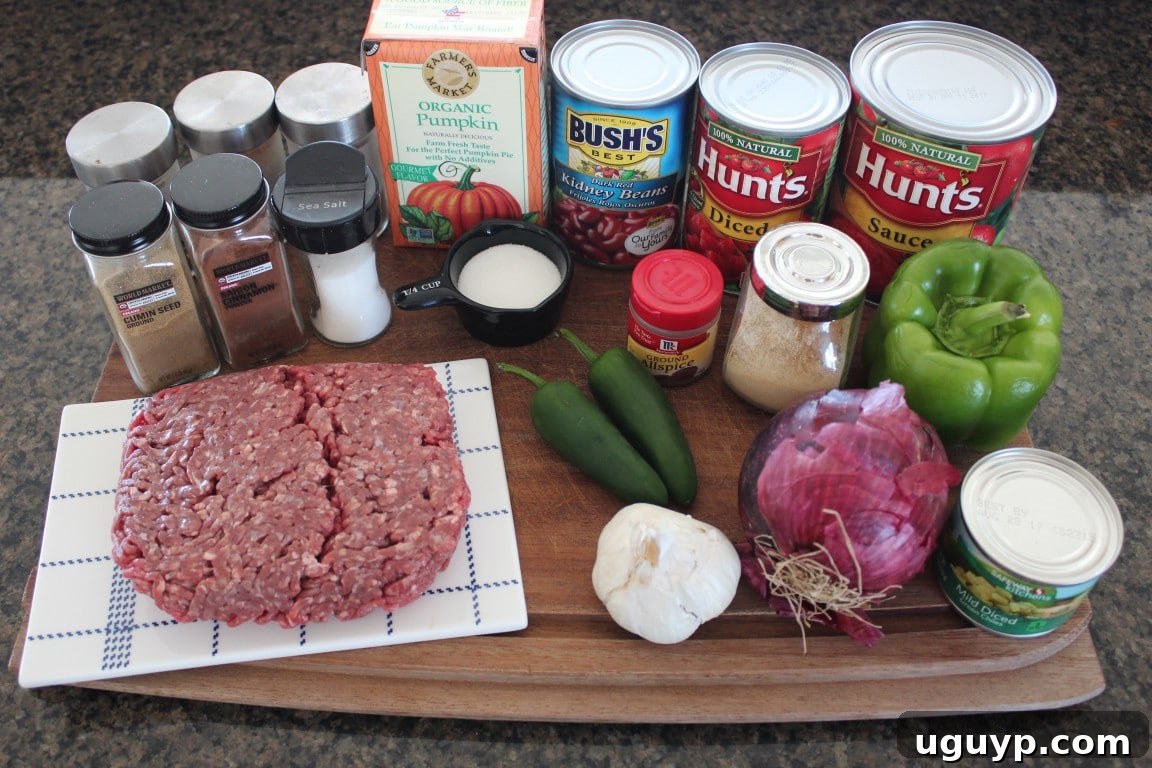 Pumpkin Chili Ingredients on a wooden cutting board.