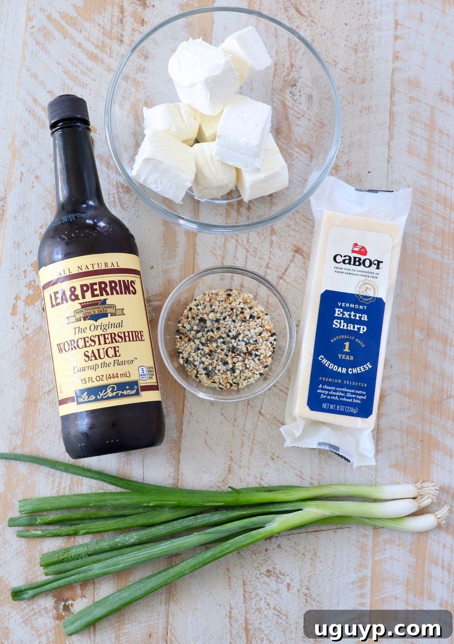 All the fresh and vibrant ingredients laid out to make the Everything Bagel Cheddar Cheese Ball.