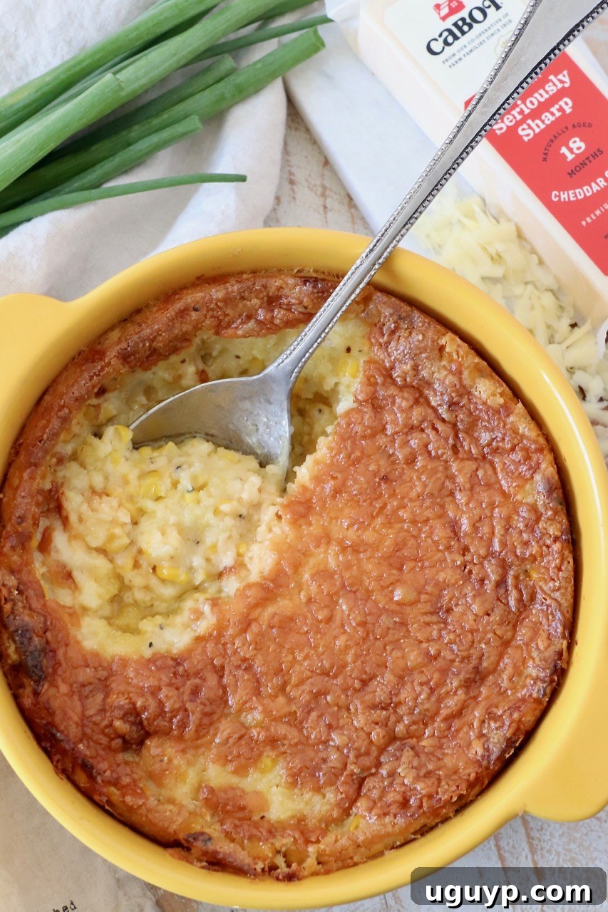 Deliciously golden corn casserole in a yellow baking dish, ready to be served, a perfect side dish for any meal.