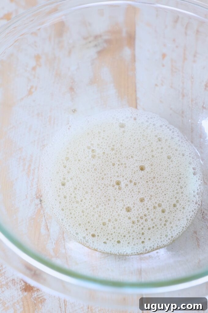 whisked egg white in glass bowl