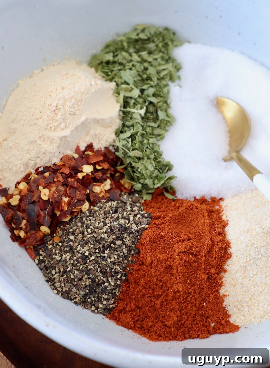 spices in bowl with gold spoon
