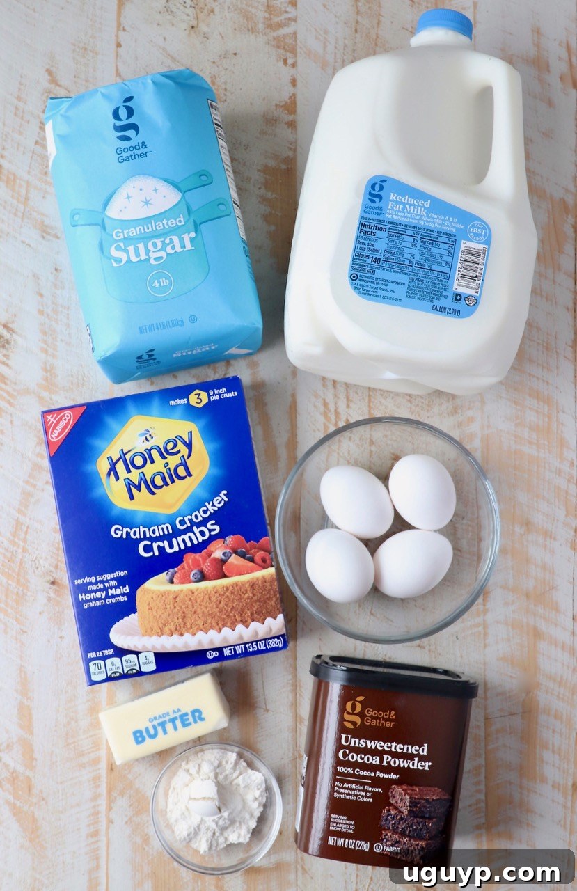 All the essential ingredients for making a delicious homemade chocolate pie laid out on a kitchen counter.