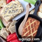 smoked cream cheese in skillet with wood serving spoon