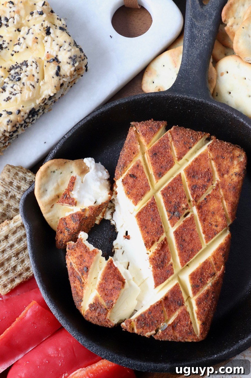 smoked seasoned cream cheese in cast iron skillet with crackers