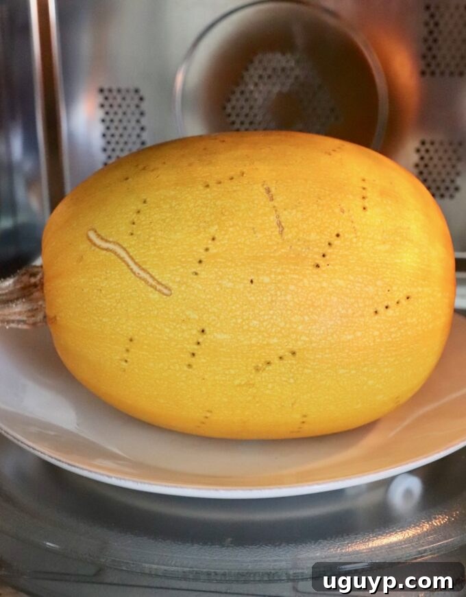 A whole spaghetti squash on a microwave-safe plate, inside a microwave oven.