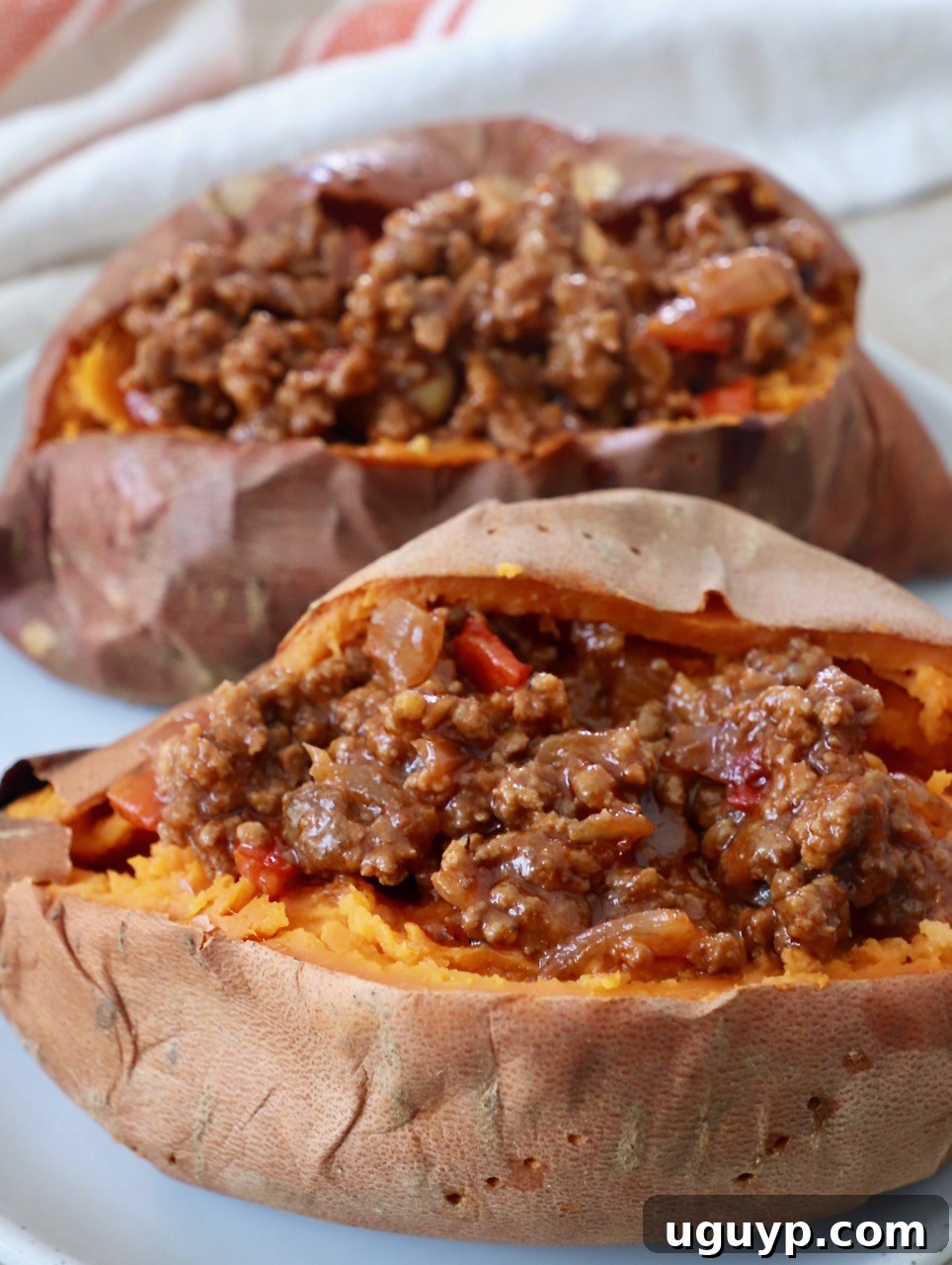 Baked sweet potatoes generously stuffed with a savory sloppy joe filling