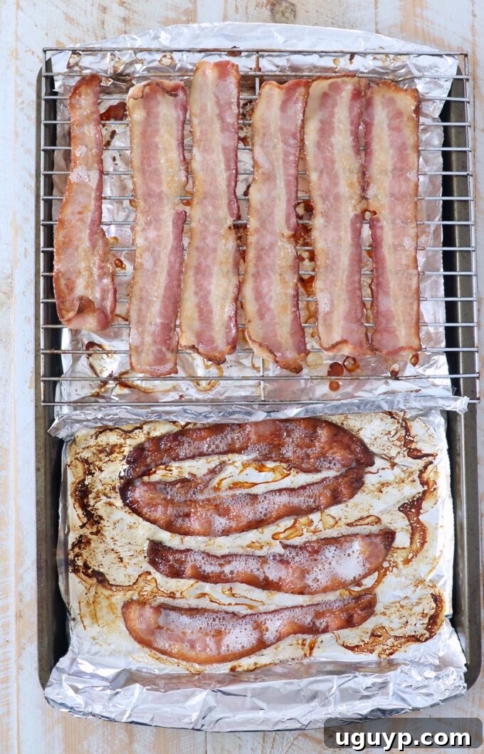 Crispy bacon strips on a baking sheet, cooked to a lighter golden brown, illustrating a shorter baking time.