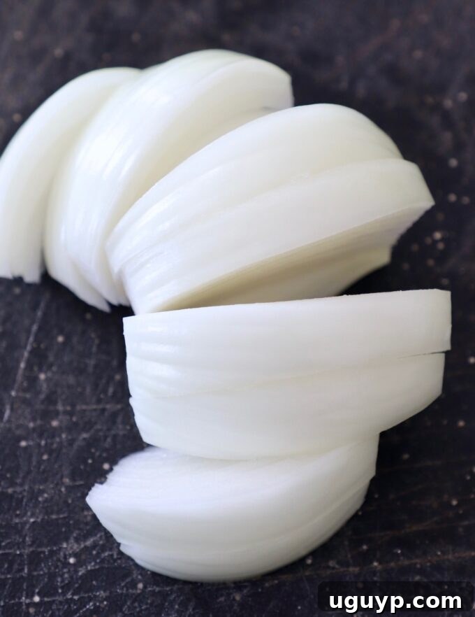 slices of onion on cutting board