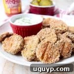 Crispy Buffalo Pickle Chips are dipped in buffalo sauce, then rolled in a spicy Rice Chex mixture and baked golden brown for the perfect gluten-free & vegetarian snack!