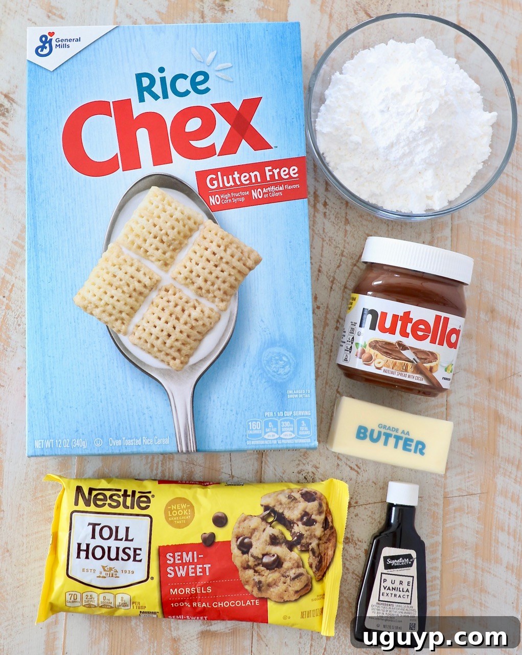Arrangement of 6 simple ingredients for making Nutella Muddy Buddies on a countertop.