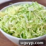 shredded brussels sprouts in white bowl