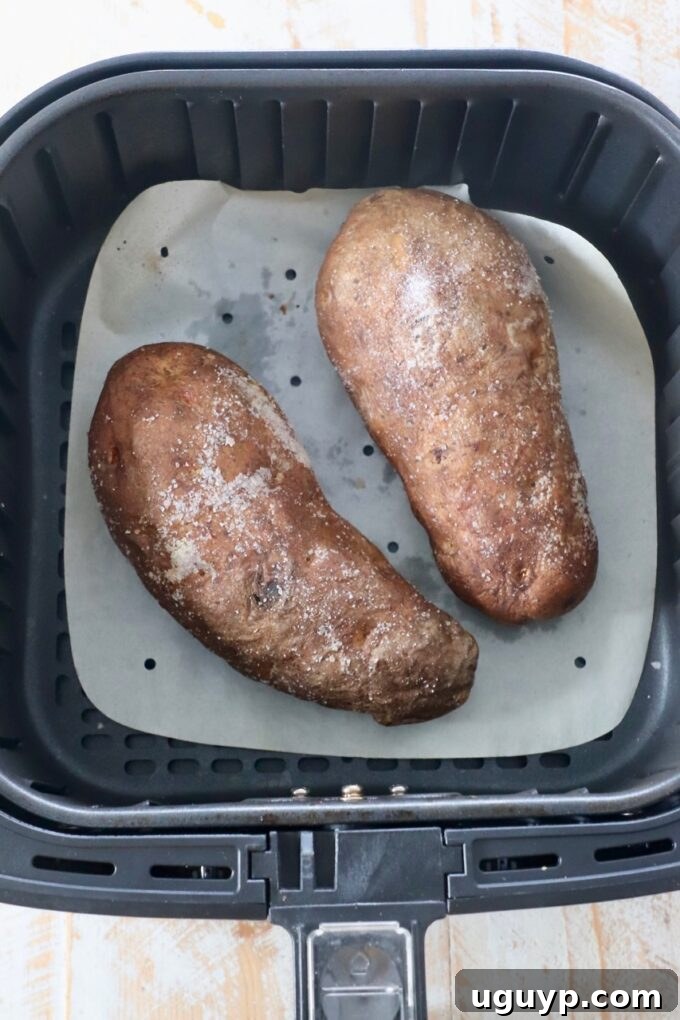 cooked russet potatoes in air fryer basket