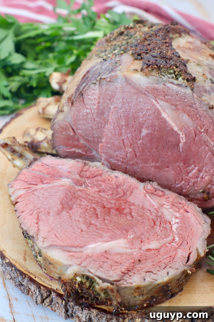 bone in prime rib on wood cutting board with slice cut off of the meat
