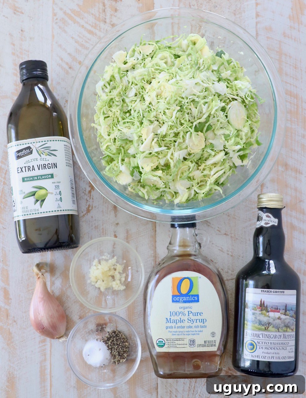 ingredients for sauteed shaved brussels sprouts on white wood board