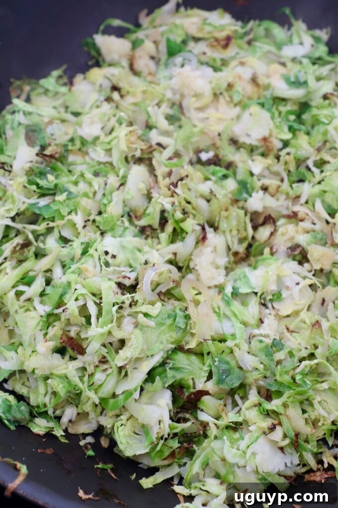 cooked shredded brussels sprouts in skillet