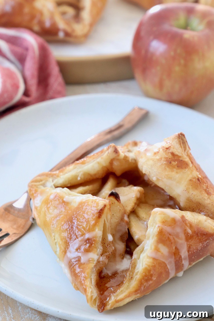 apple danish on plate with fork