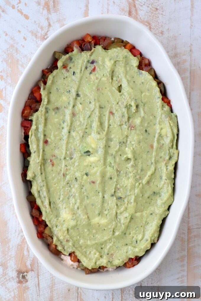 Smooth guacamole spread as a layer in a casserole dish