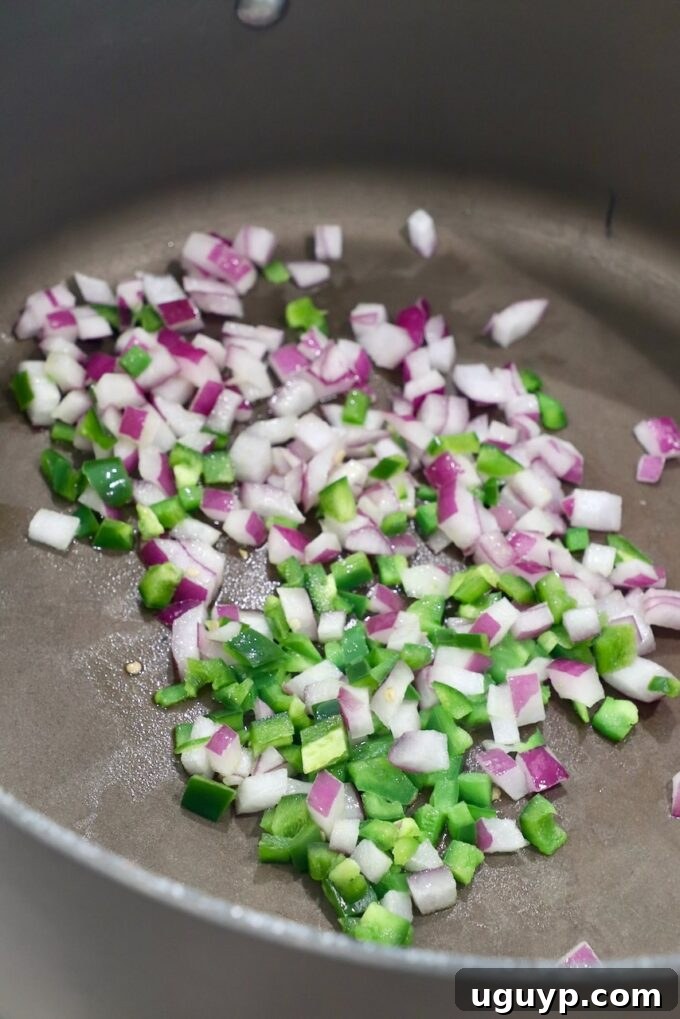 diced jalapenos and onions in large skillet