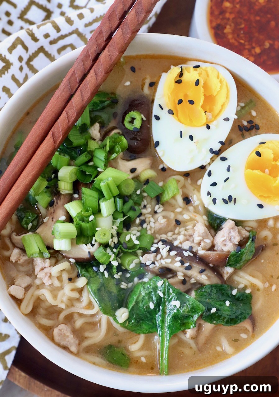 A steaming bowl of Miso Ramen, garnished with fresh toppings and chopsticks on the side, ready to be enjoyed.