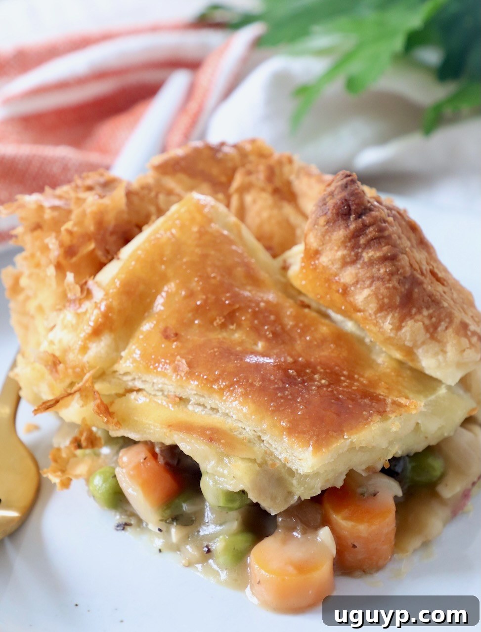 piece of vegetable pot pie on plate with fork