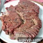 Sliced smoked chuck roast on a plate