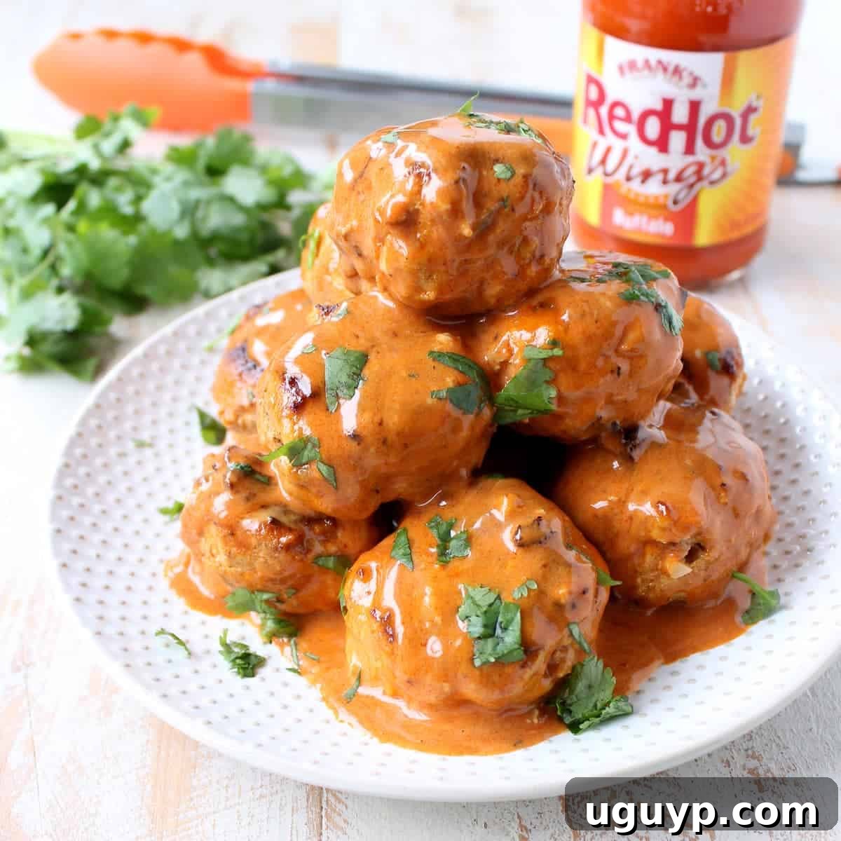 Sweet, hot, and tangy Honey Mustard Buffalo Meatballs, perfect as an appetizer or served as meatball subs.