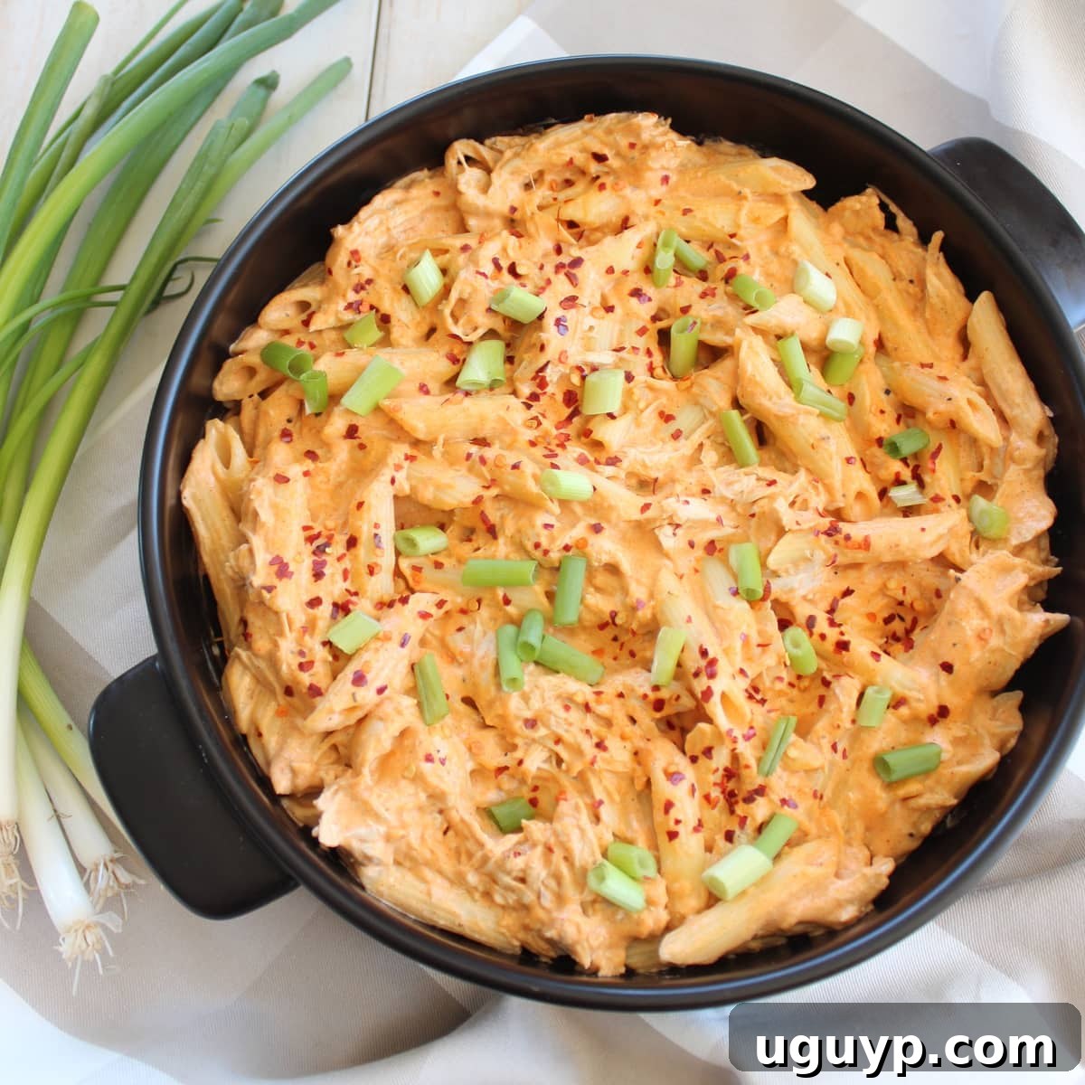 Creamy and cheesy buffalo chicken penne pasta dish, generously coated in a rich buffalo sauce.