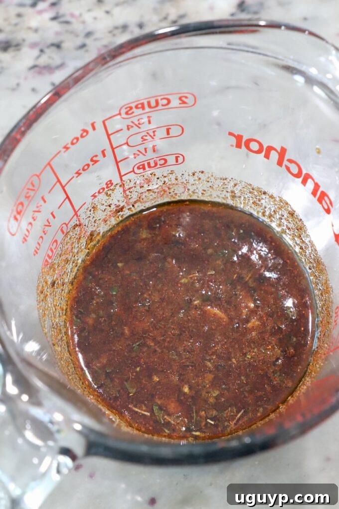 steak marinade in glass measuring cup