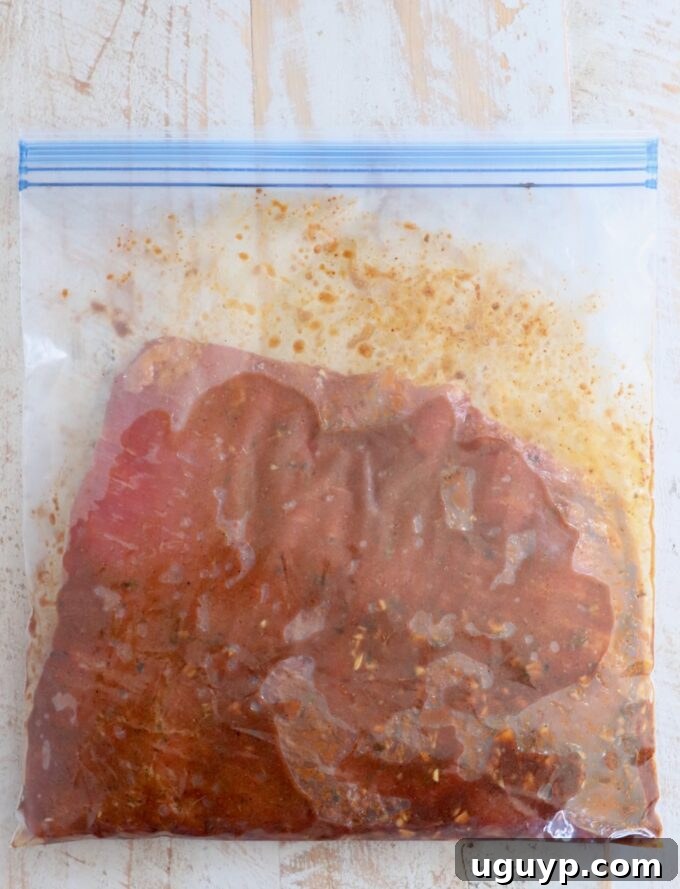 flank steak in marinade in large zipper bag