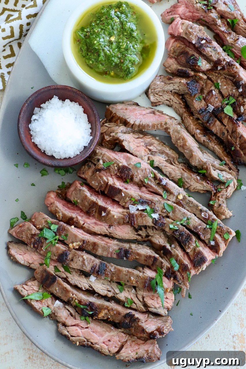 Perfectly sliced grilled skirt steak presented on a plate
