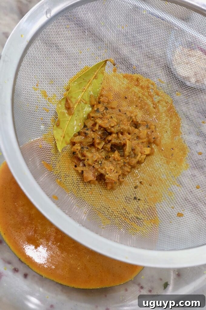 curry sauce pushed through a fine mesh strainer