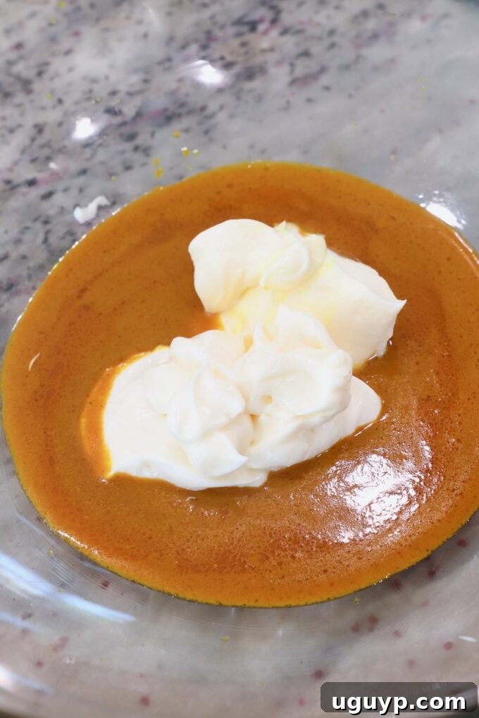 curry sauce in a glass bowl with mayonnaise and creme fraiche