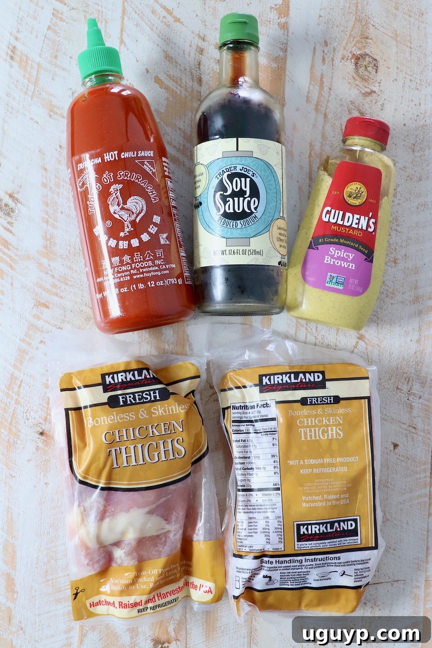 ingredients for chicken thigh marinade on white wood board