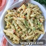 prepared pasta salad in bowl with forks, ready to be enjoyed