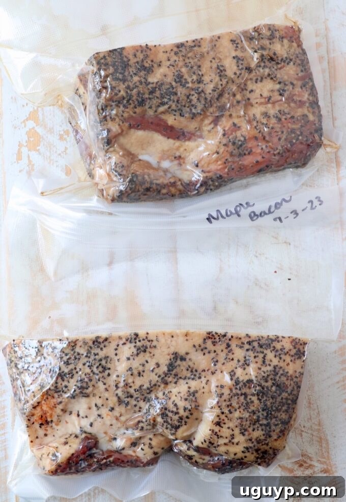 Vacuum-sealed, cured bacon slabs in bags, ready for long-term freezer storage.