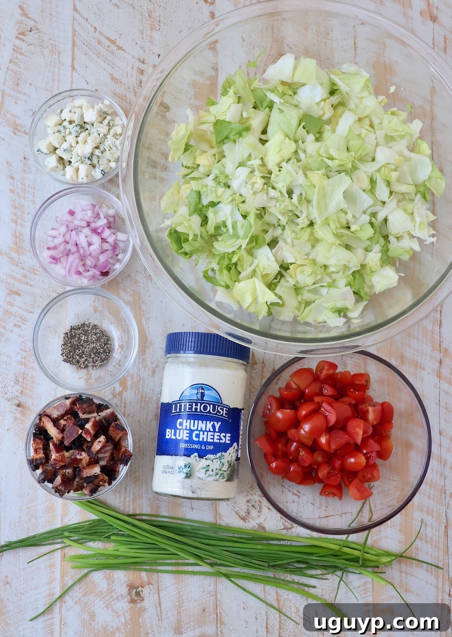 blue cheese salad ingredients on white wood board