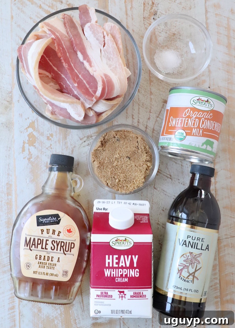 Assortment of fresh ingredients for maple bacon ice cream laid out on a white wooden board