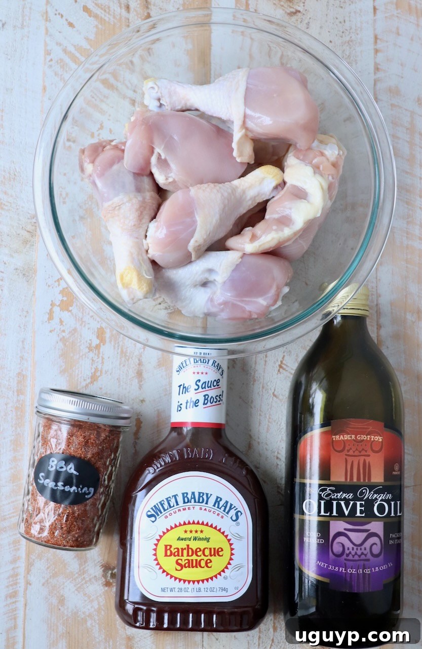 A vibrant selection of ingredients laid out on a wooden board, ready for preparing the ultimate BBQ chicken.