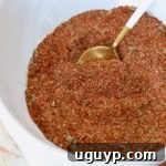 Homemade Enchilada Seasoning in a bowl with a spoon