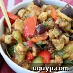 eggplant salad in bowl with spoon