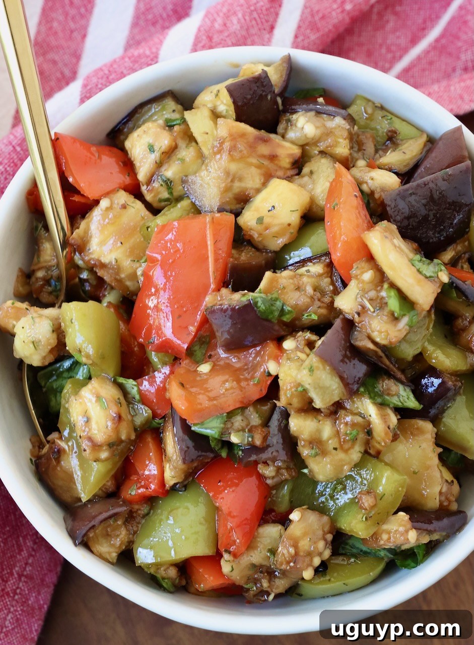 marinated eggplant salad in bowl with spoon