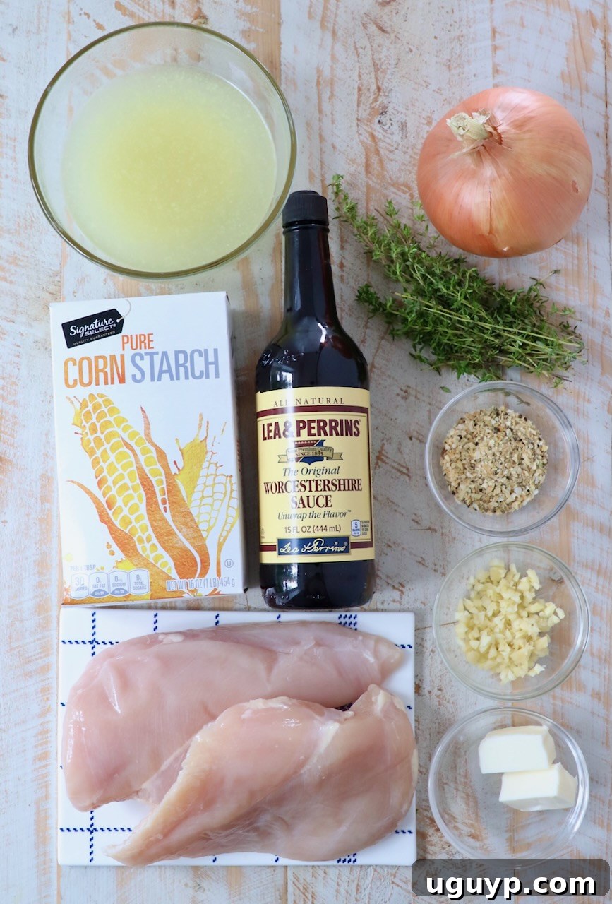 ingredients for french onion chicken on white wood board