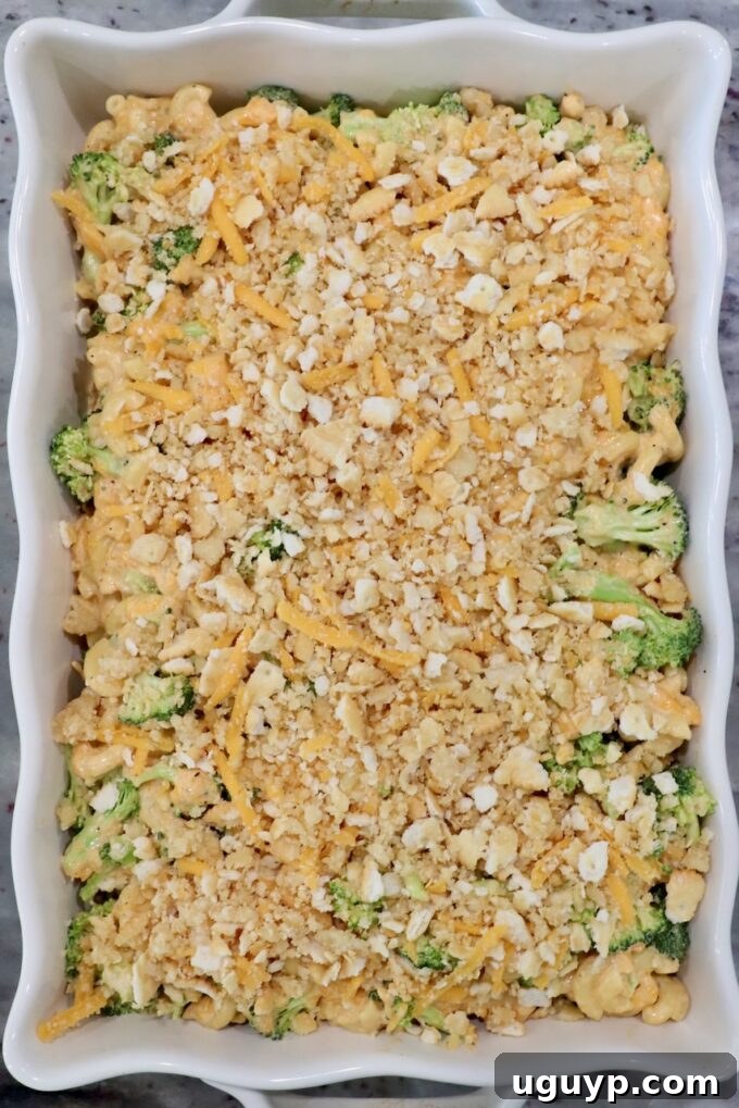 broccoli mac and cheese in casserole dish topped with Ritz cracker topping