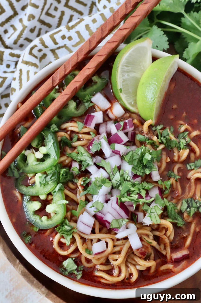 birria ramen in bowl with chopsticks on the side