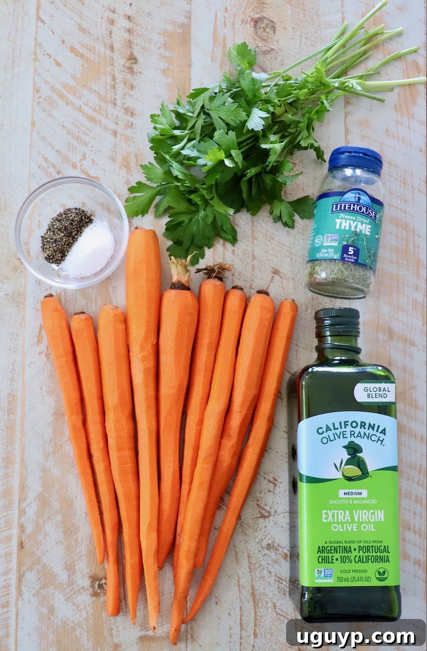 Fresh ingredients for roasted carrots, including whole carrots, olive oil, dried thyme, salt, pepper, and fresh parsley, arranged on a rustic white wood board.