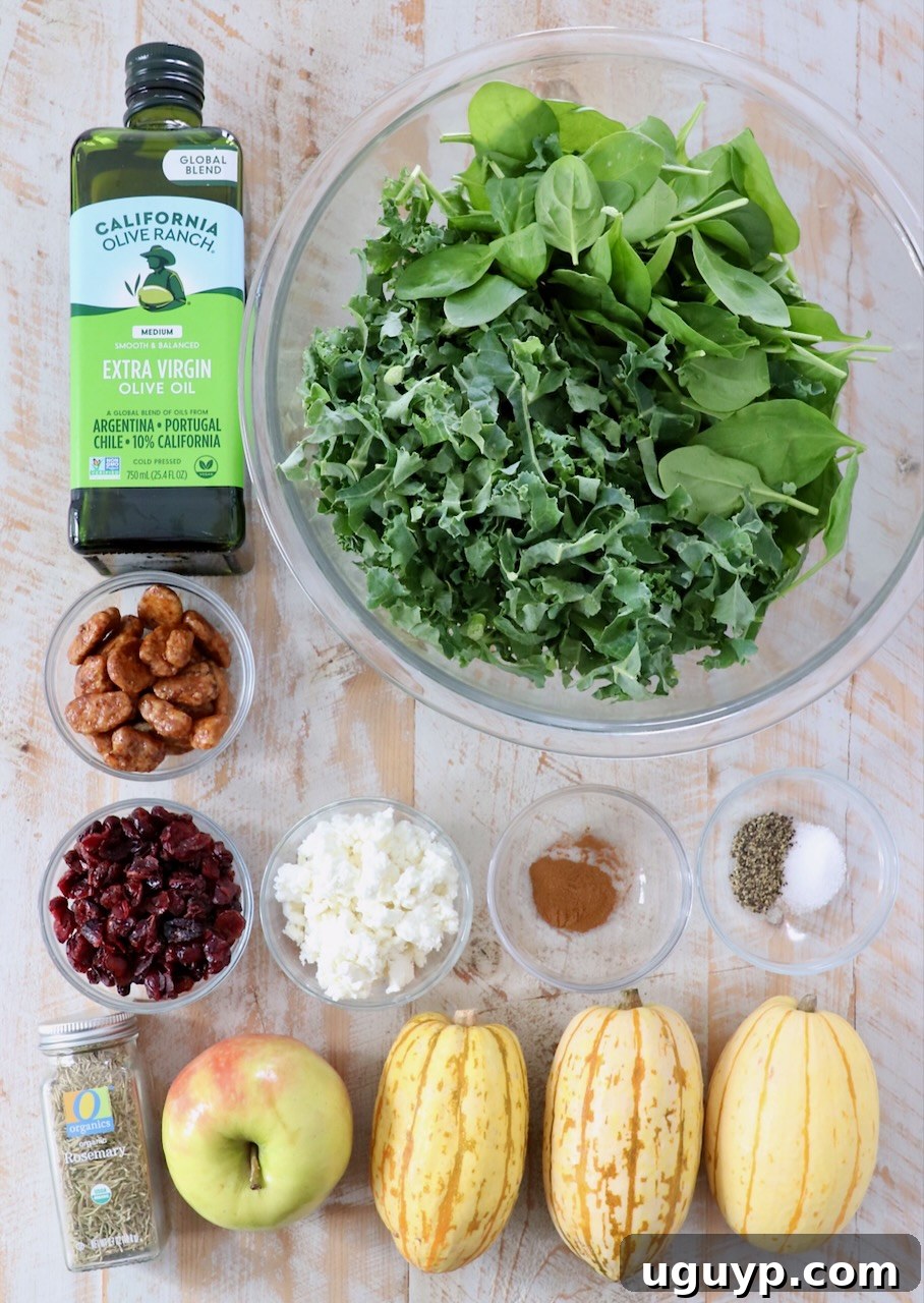 Fresh ingredients for Delicata Squash Salad laid out on a white wooden board