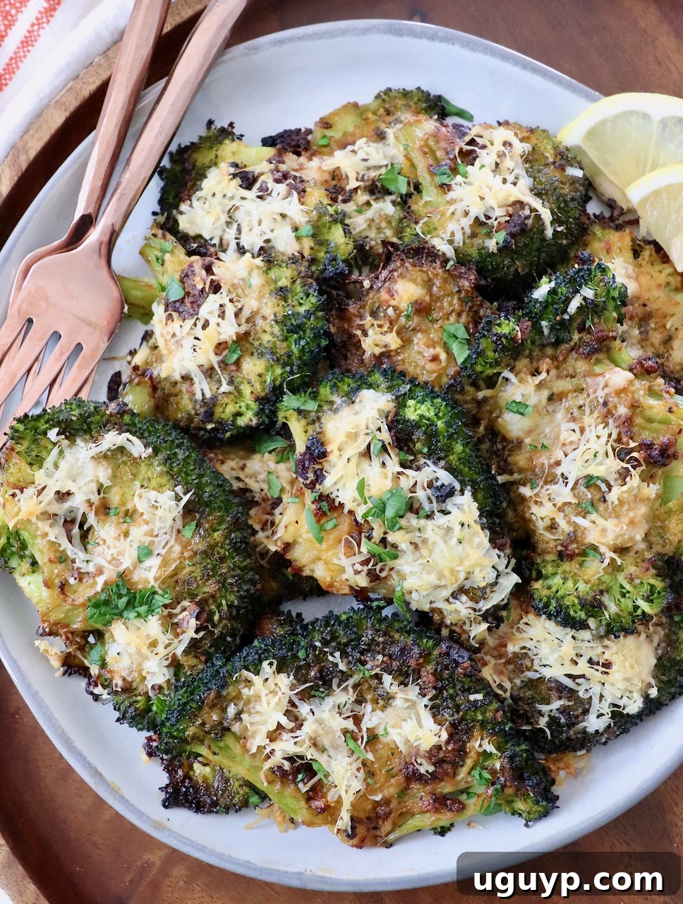 Smashed Broccoli on a plate with forks