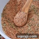 meatloaf seasoning in bowl with wood spoon